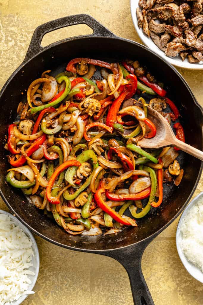 steak and peppers in skillet