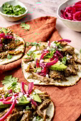 shredded beef tacos with toppings