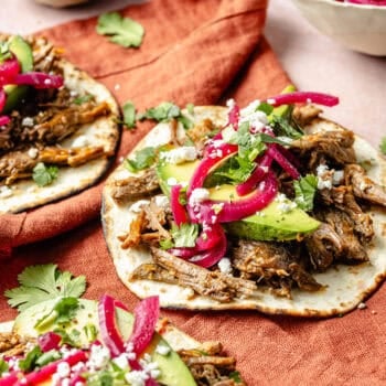 shredded beef tacos with toppings