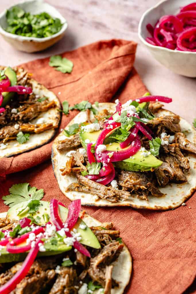 shredded beef tacos with toppings
