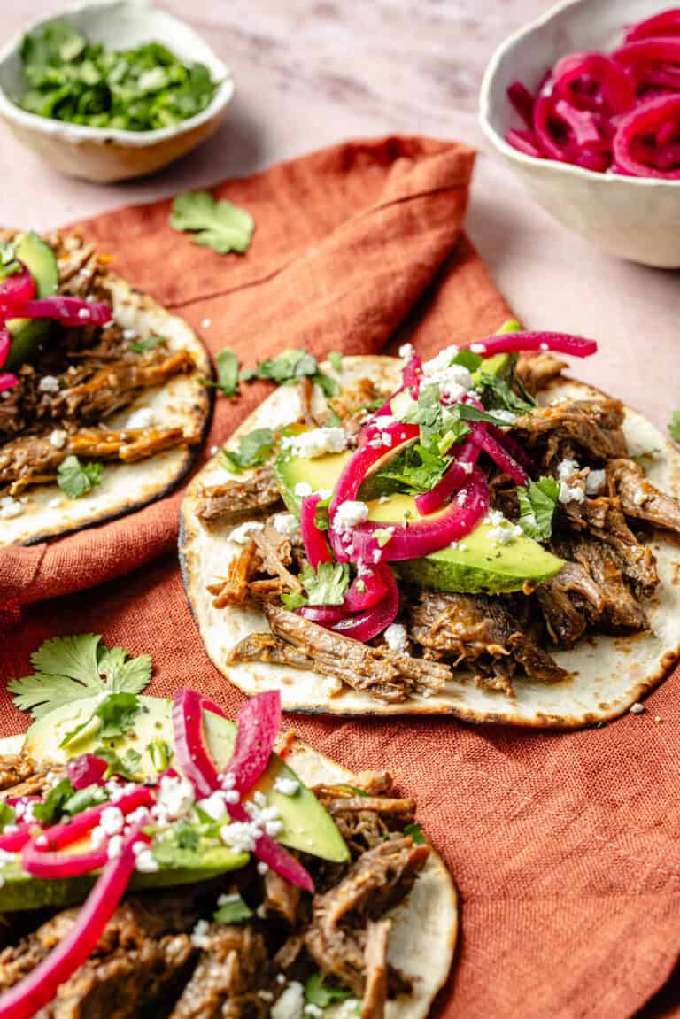 shredded beef tacos with toppings