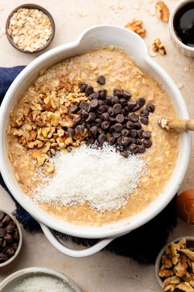 baked oatmeal batter with chocolate chips, nuts, and coconut
