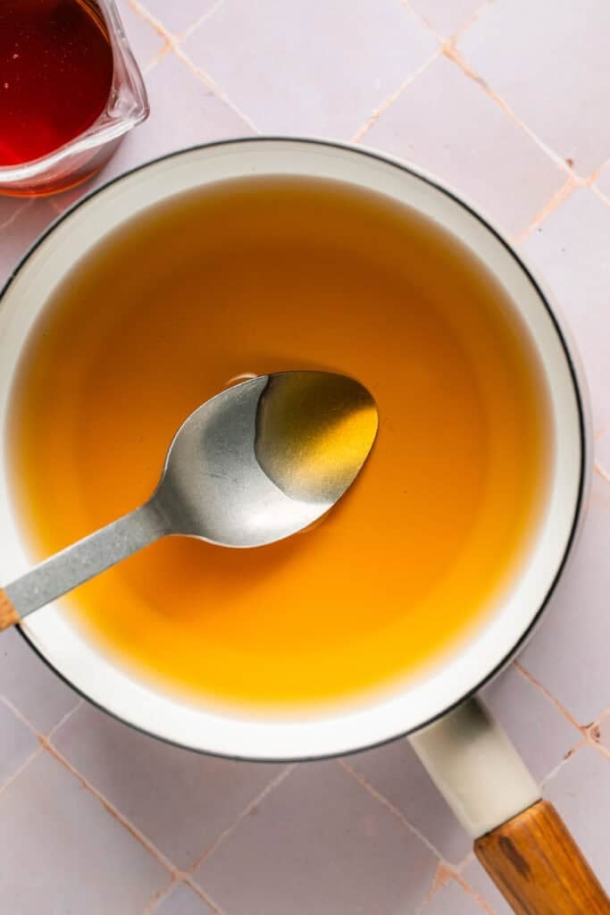 simple syrup in sauce pan with spoon