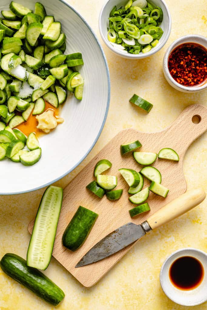 cucumbers being sliced for sale
