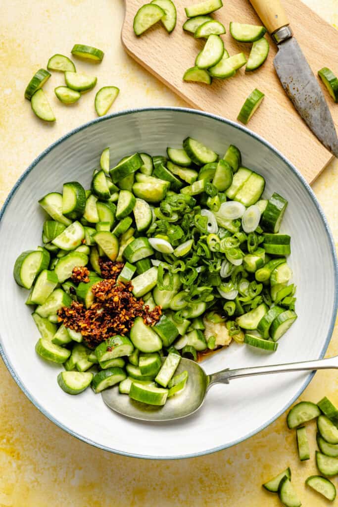 cucumber salad ingredients in mixing bowl
