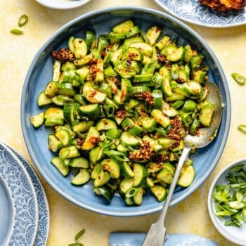 cucumber salad in bowl with spoon