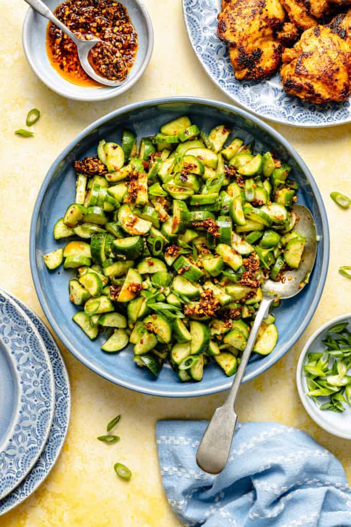 cucumber salad in bowl with spoon