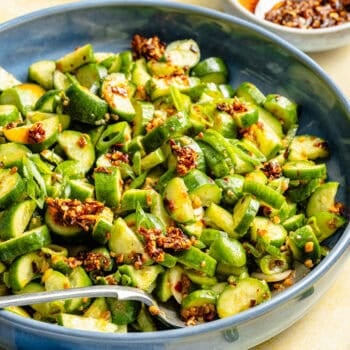 cucumber salad in bowl with spoon