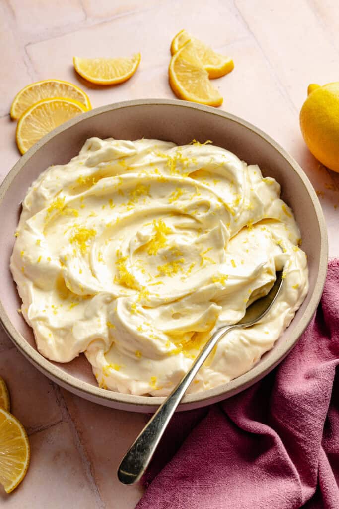 lemon cream cheese frosting in bowl with lemon zest