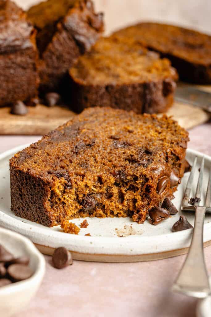 slice of pumpkin banana bread on plate with fork