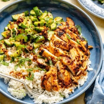 red curry chicken thighs with cucumber salad and rice