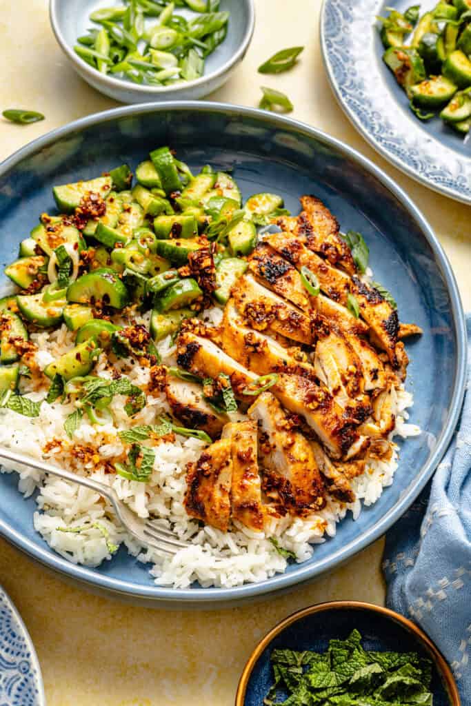 red curry chicken thighs with cucumber salad and rice