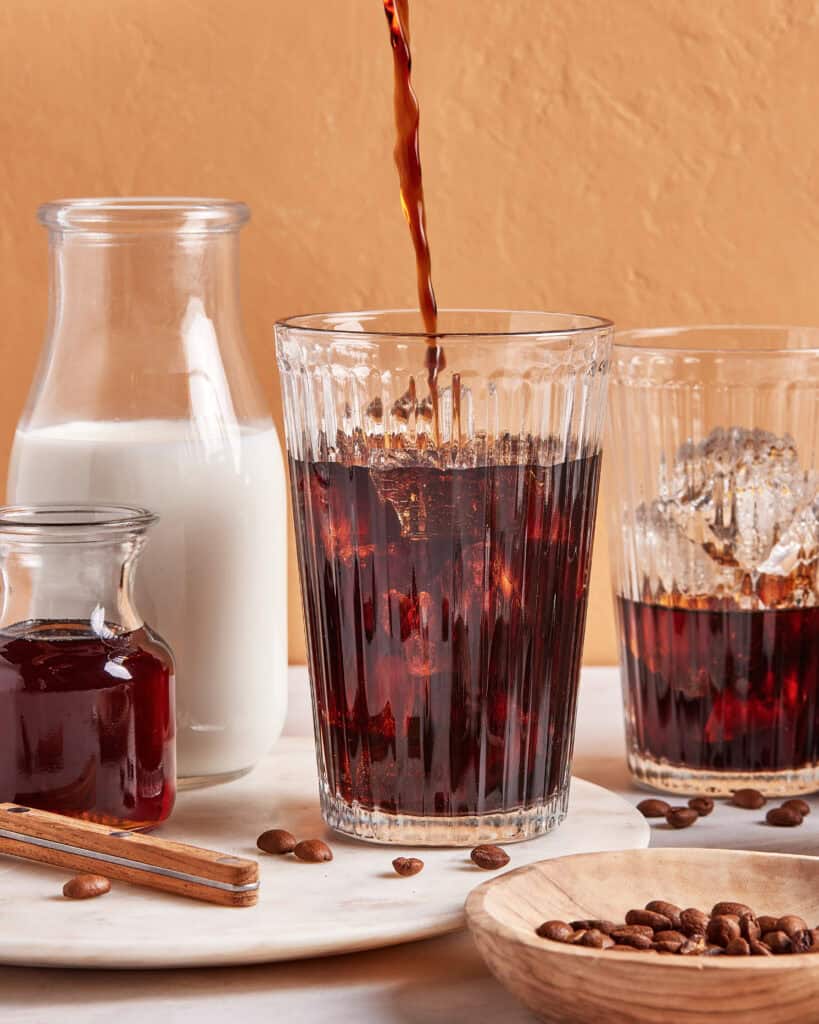 iced coffee being poured over ice