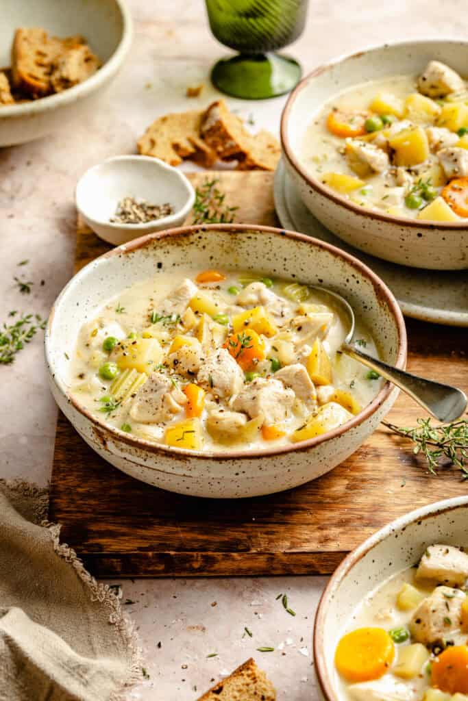 chicken pot pie soup in one bowl with a spoon