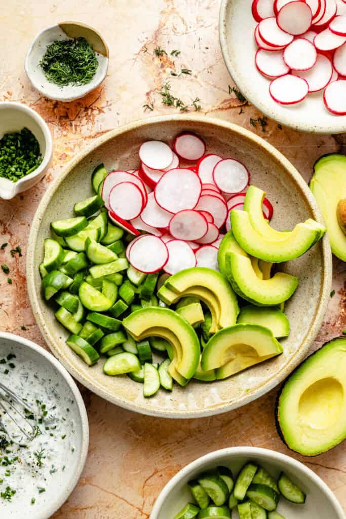 salad ingredients in mixing bowl
