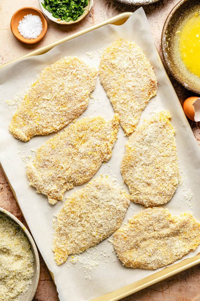 breaded chicken cutlets on sheet pan