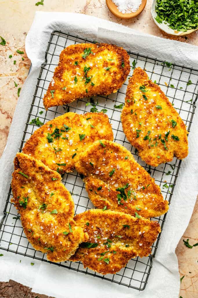 crispy chicken cutlets on wire rack