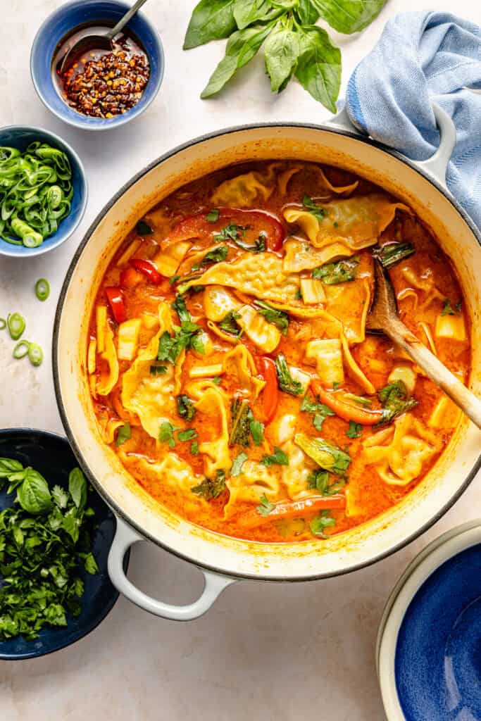 soup in pot with wooden spoon
