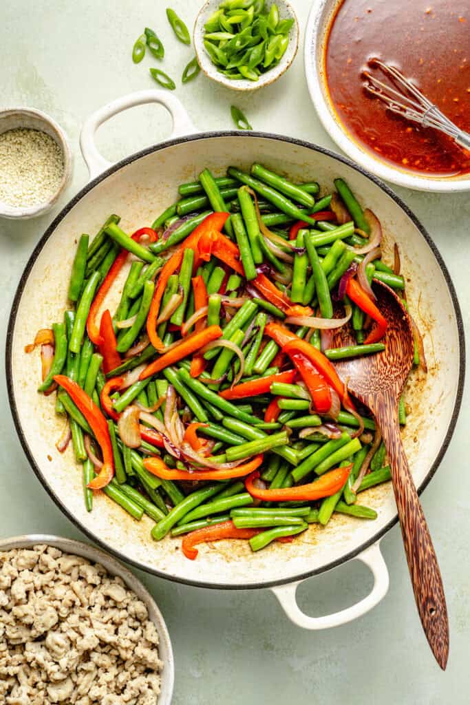 veggies being sautéed in skillet