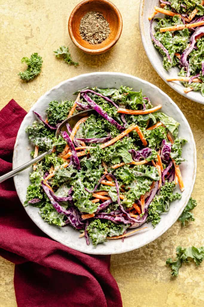 kale slaw in bowl with spoon