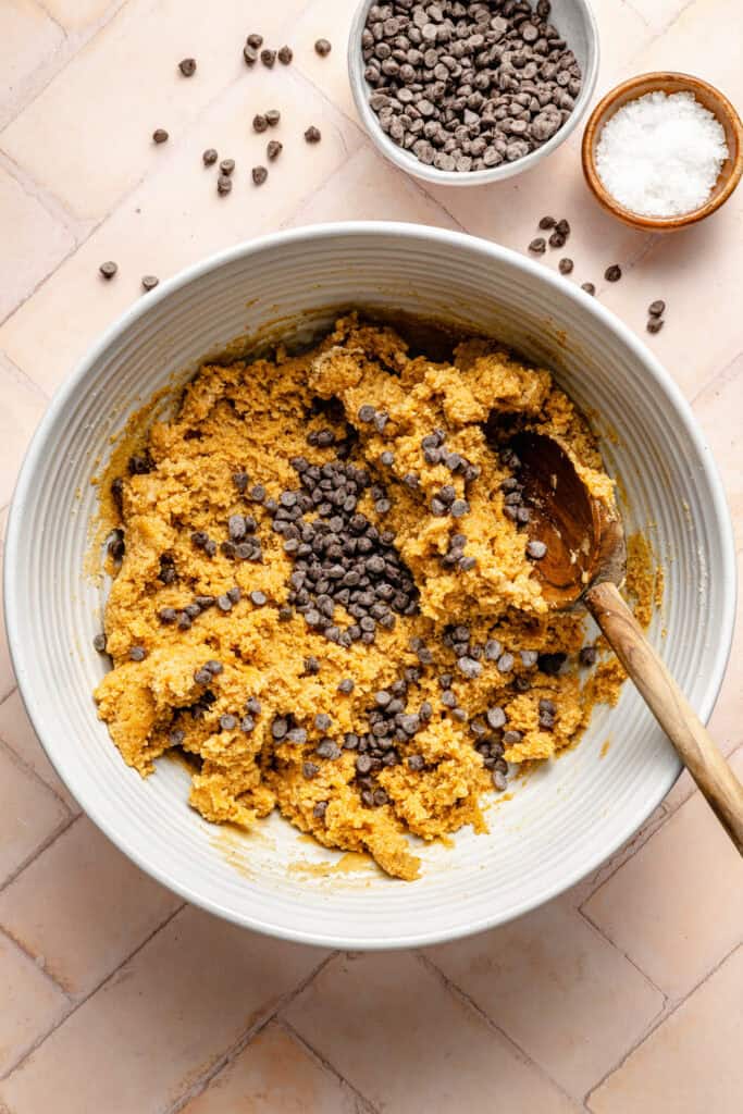 pumpkin protein ball batter in bowl with chocolate chips