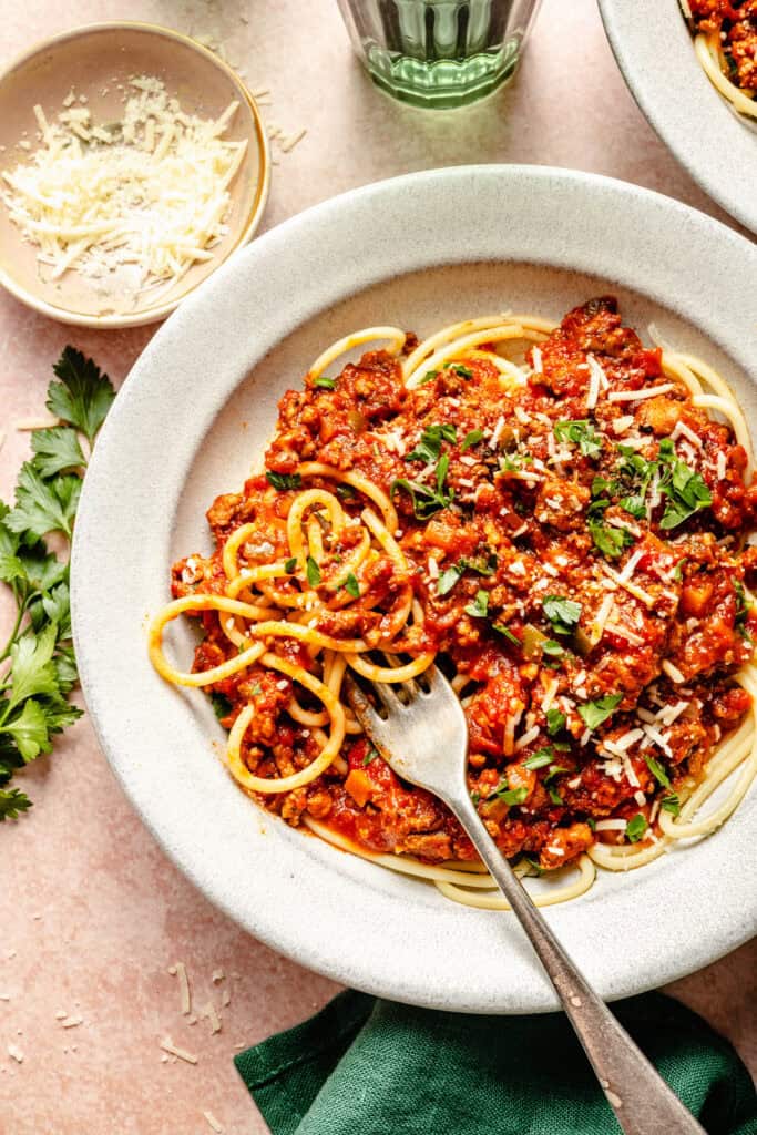 spaghetti sauce over spaghetti noodles with fork