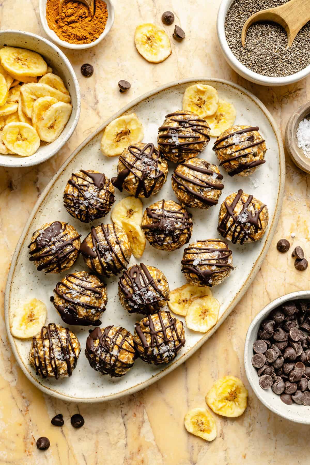 energy bites on plate drizzled with chocolate