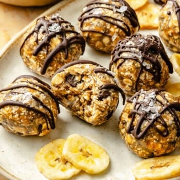 energy bites on plate drizzled with chocolate