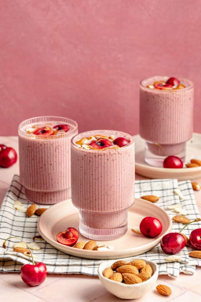cherry almond smoothie in 3 glasses