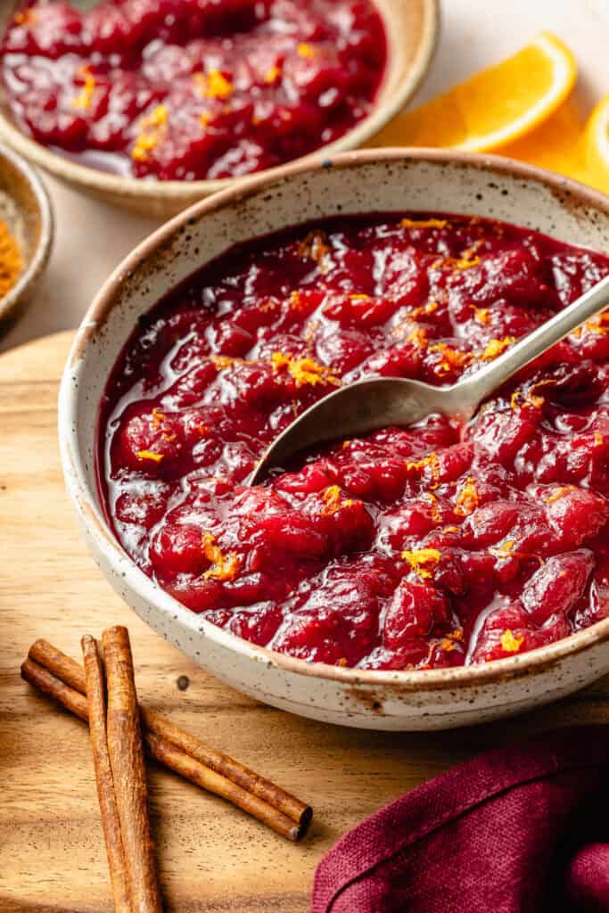 homemade cranberry sauce in bowl with spoon