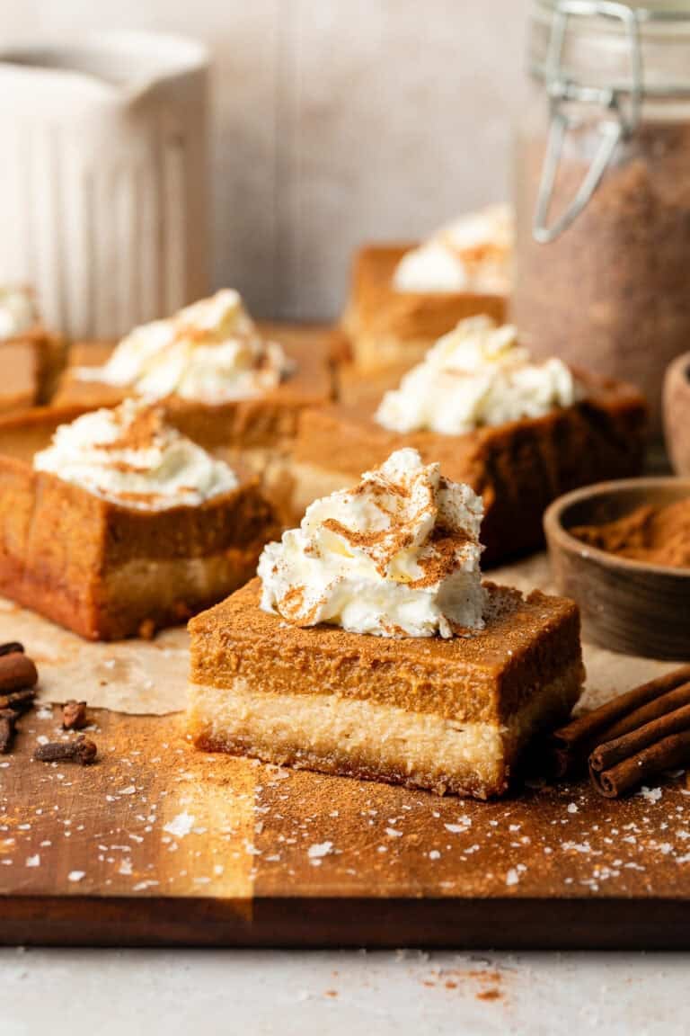 sweet potato pie bar topped with whipped cream