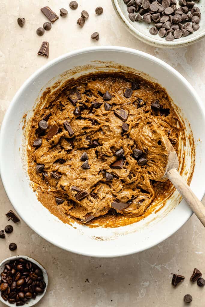 cookie dough in mixing bowl with spatula
