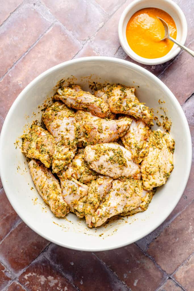 seasoned wings in mixing bowl