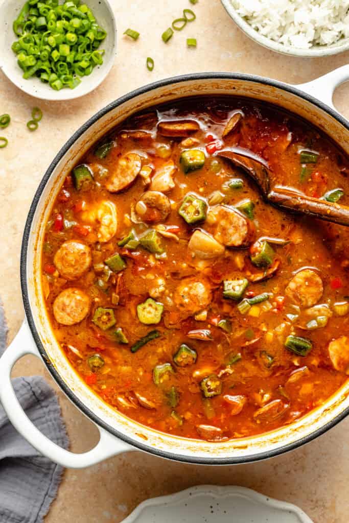 gluten free gumbo in pot with wooden spoon