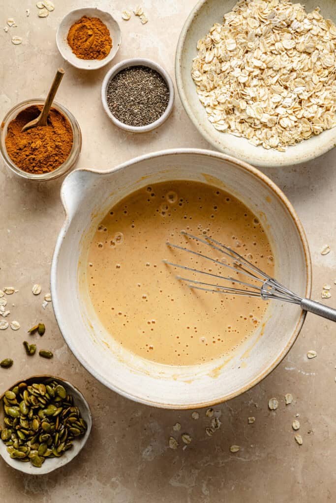 wet ingredients in bowl with whisk