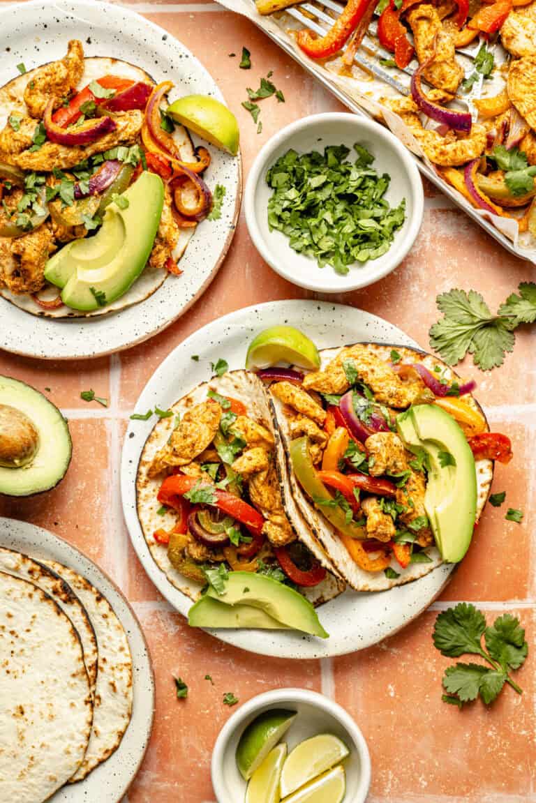 sheet pan chicken fajitas served in tortillas