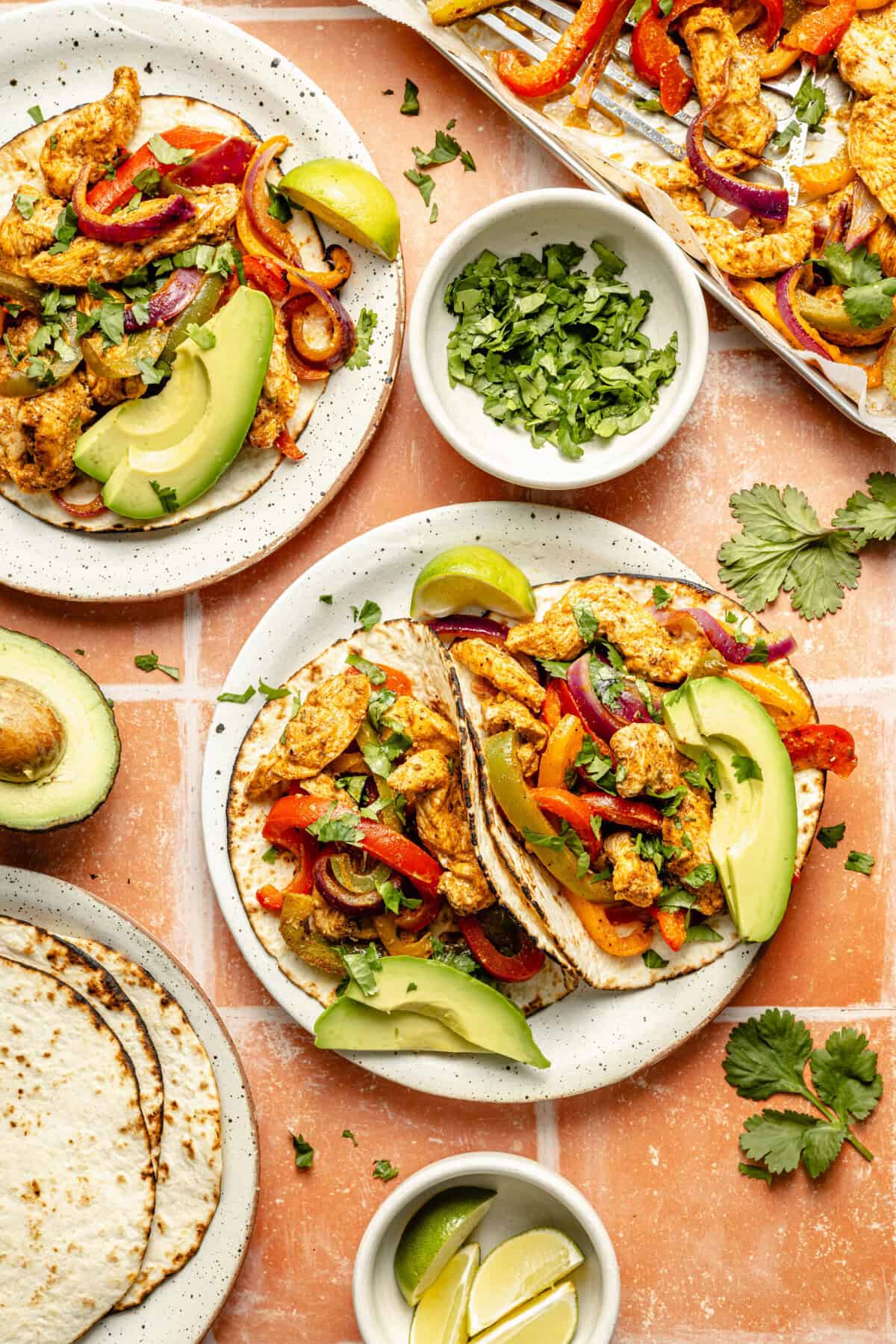 sheet pan chicken fajitas served in tortillas