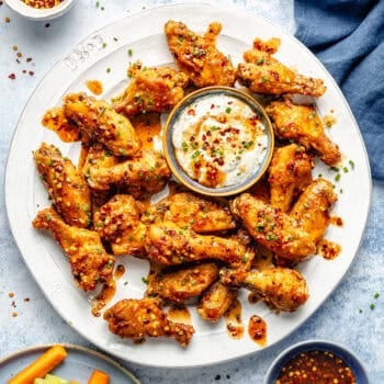 hot honey wings on plate with dip