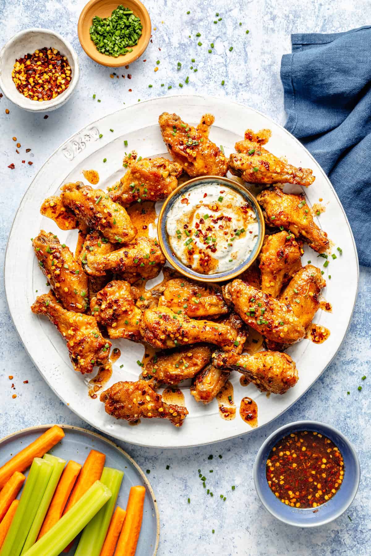 hot honey wings on plate with dip