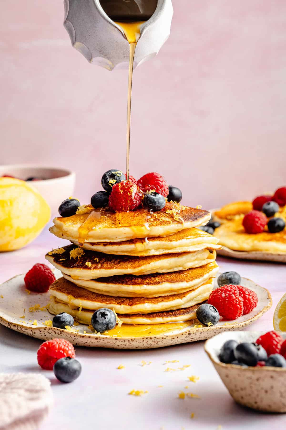 lemon ricotta pancakes with fresh fruit and syrup