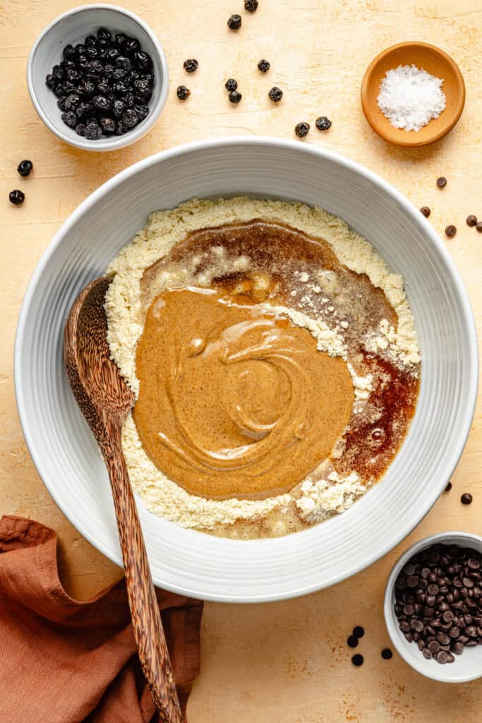 almond butter protein ball ingredients in mixing bowl