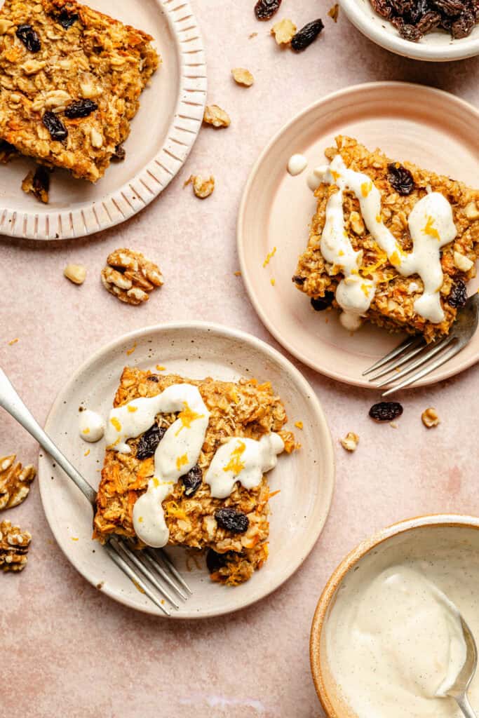 carrot cake baked oatmeal on plate with ceam cheese icing