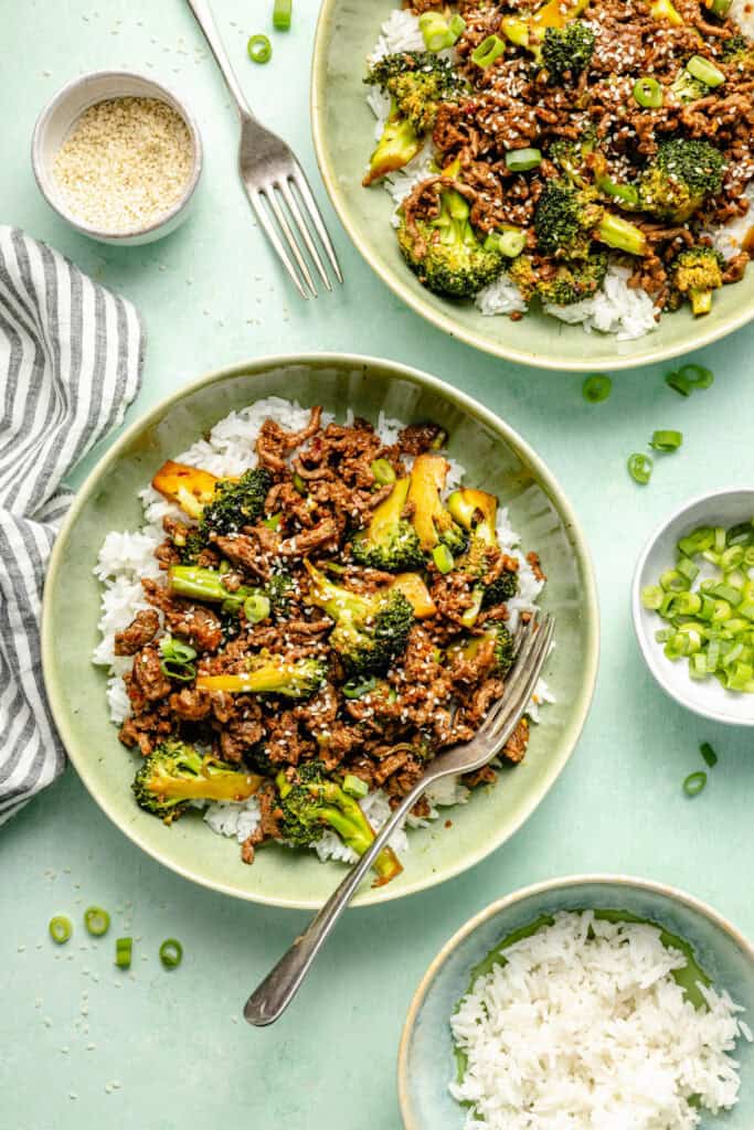 ground beef and brocoli plated over white rice in bowl
