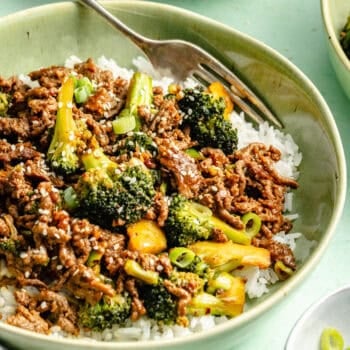 ground beef and brocoli plated over white rice in bowl