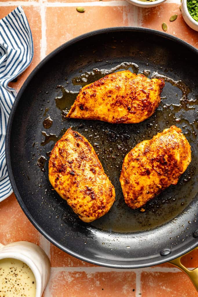 chicken searing in pan