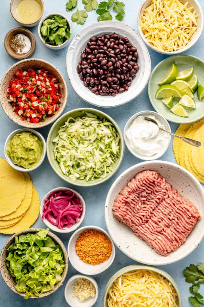 baked taco ingredients in small bowls