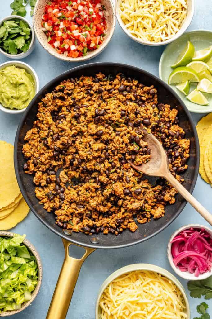 ground turkey mixture in skillet with wooden spoon