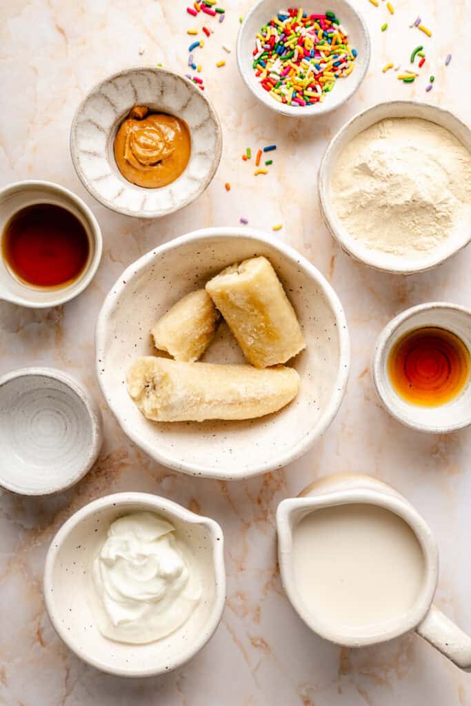 cake batter protein shake ingredients in small bowls