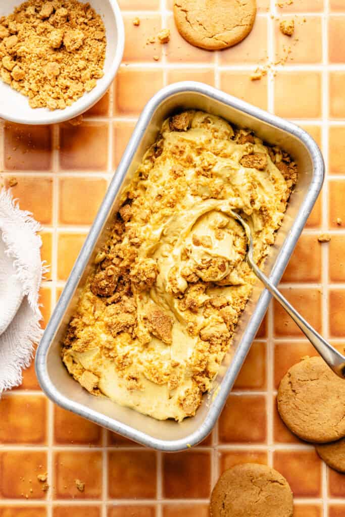high protein pumpkin pie ice cream in loaf pan with spoon 