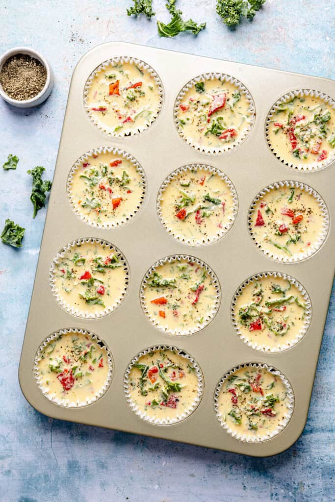 egg bites in muffin pan before baking
